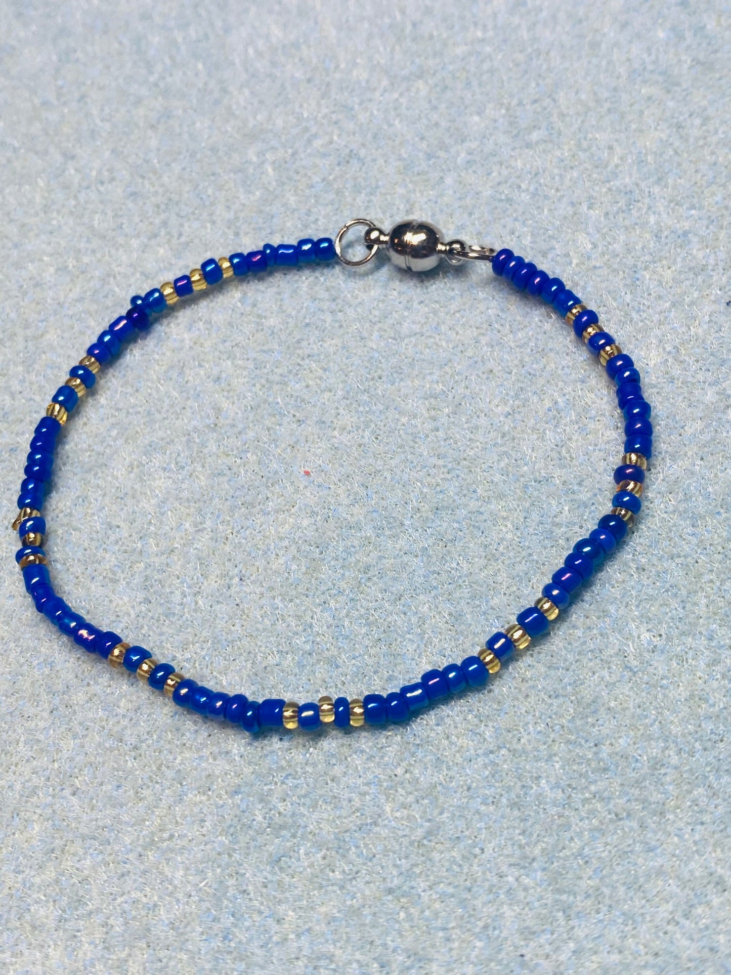 Blue and gold beaded bracelet